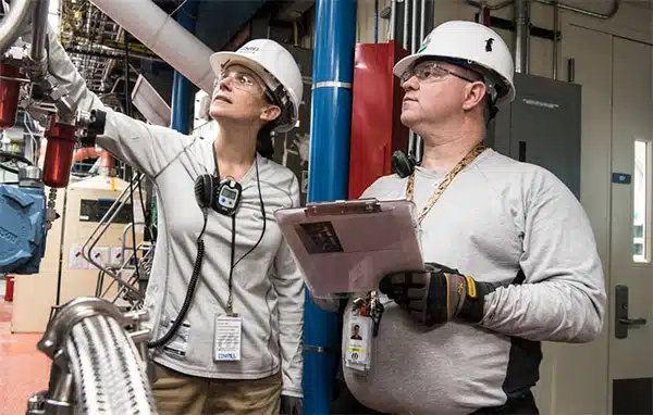 operators reviewing production schedule