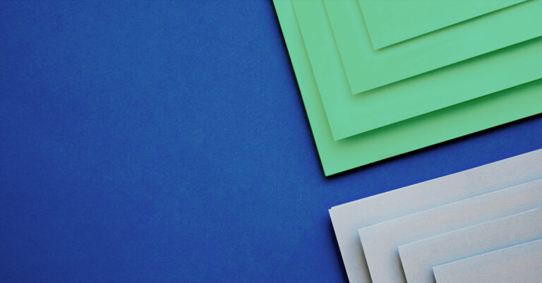 green and white stacked paper
